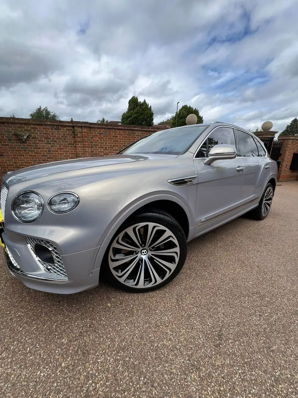 Silver Bentley Bentayga detailed at a private residence