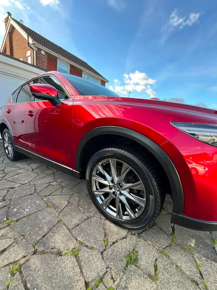 Red Mazda CX-5 valeted on a block-paved driveway