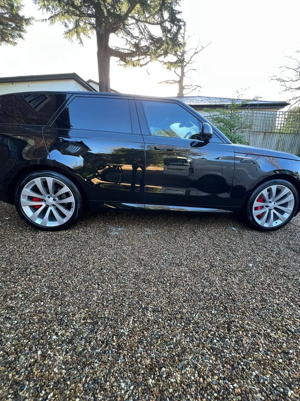 Black Range Rover Sport valeted on a customer driveway
